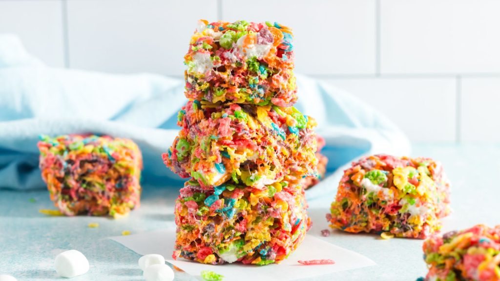 three squares of colorful fruity pebbles squares stacked on eachother
