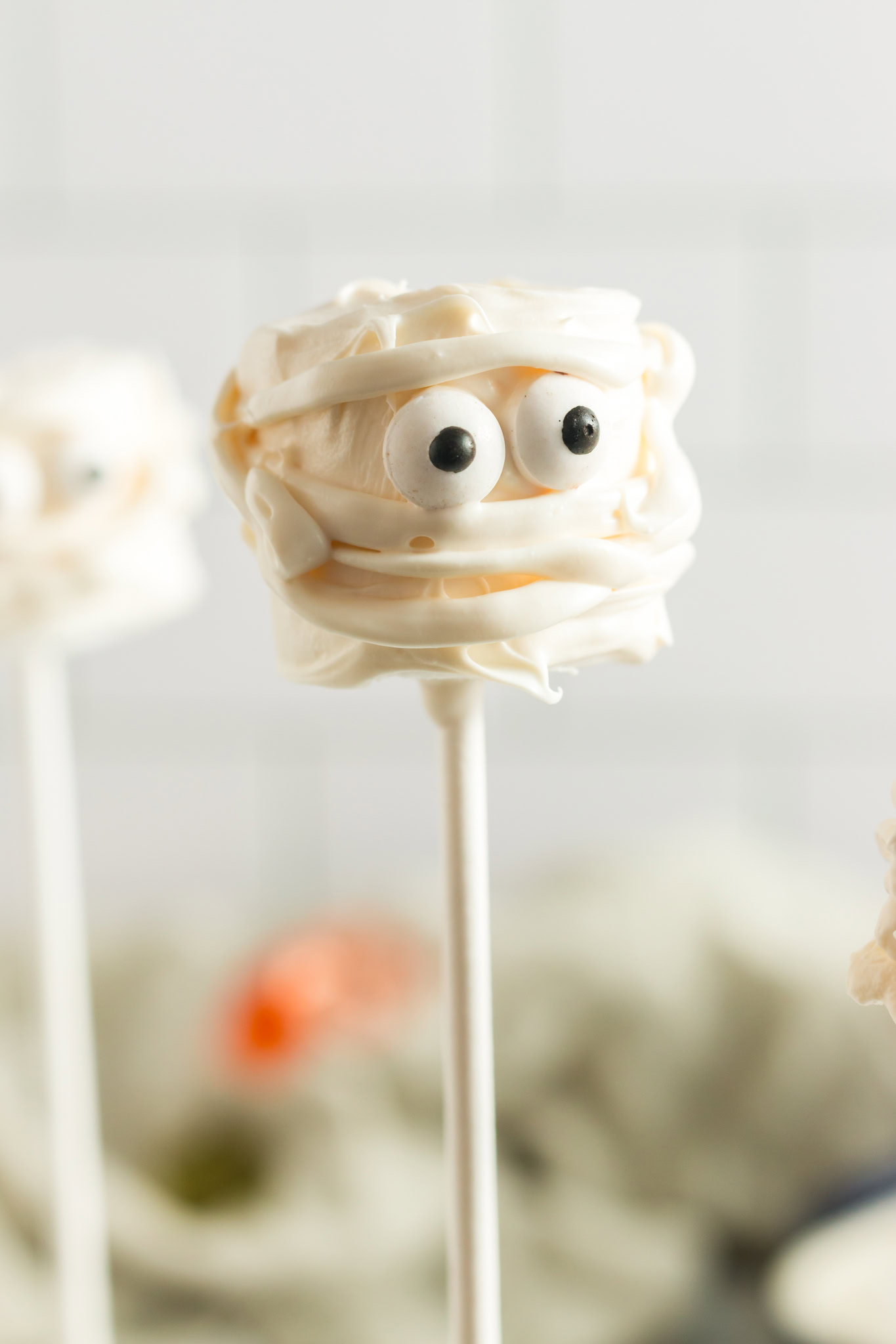 a mummy head on a stick made of white chocoalte