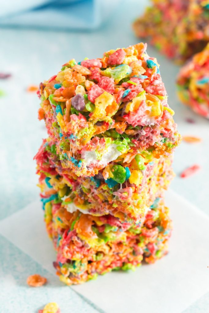 three squares of colorful fruity pebbles squares stacked on eachother